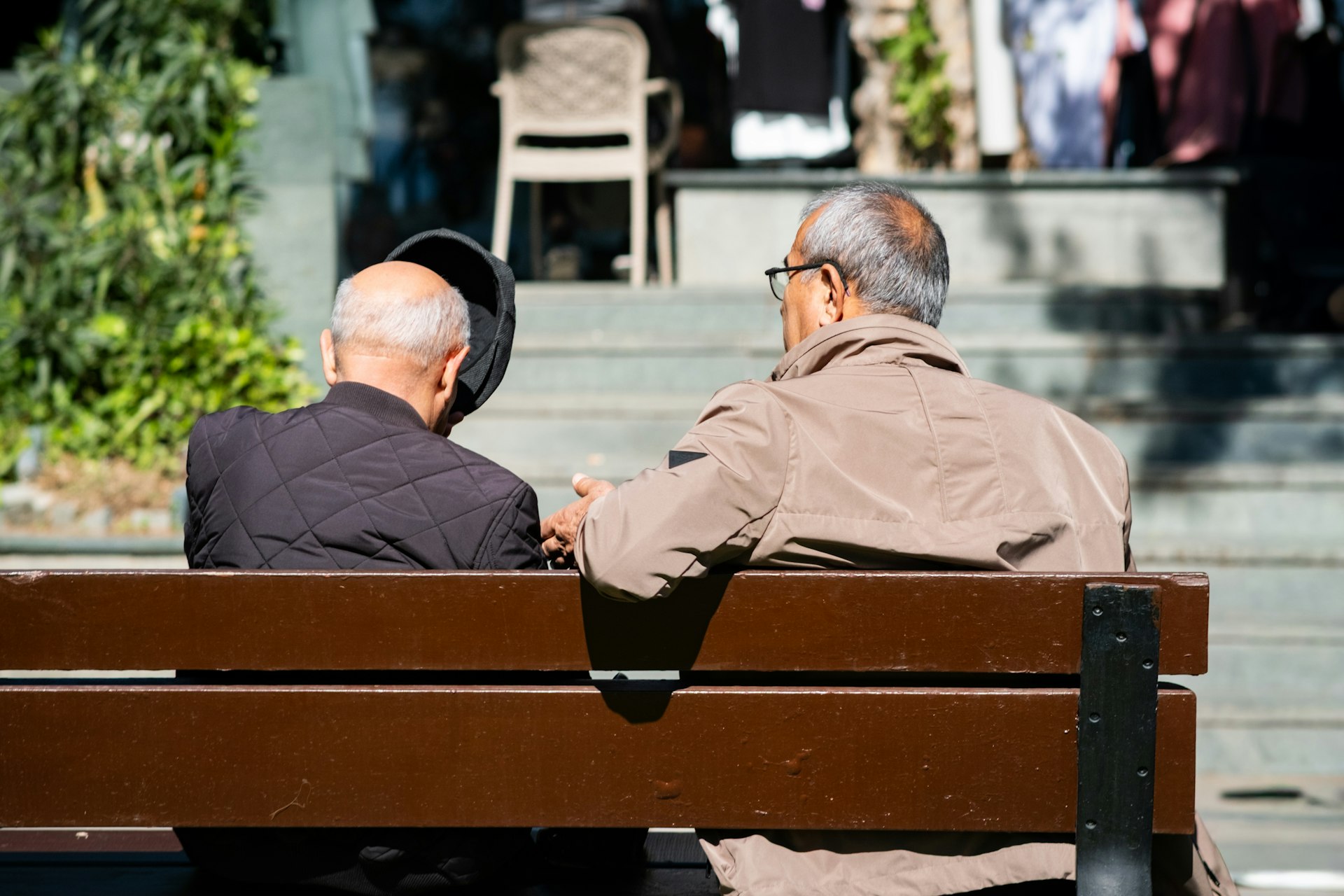 Two men sitting together, in conversation
