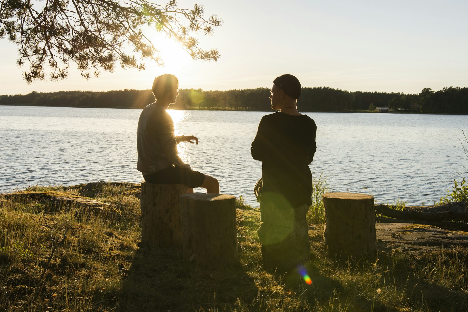 Two men in quiet conversation outdoors